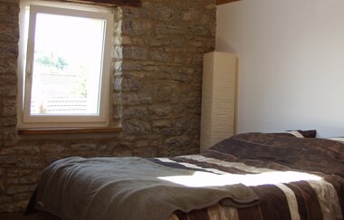 Eines der Schlafzimmer mit Doppelbett | © Touristikgemeinschaft Hohenlohe e. V.  | Klaus Schirmer